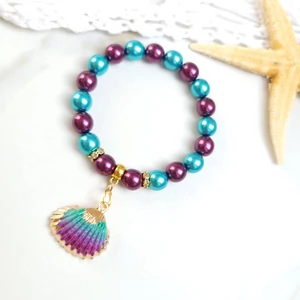 Kép 2/3 - Türkiz - Lila kagyló medálos karkötő