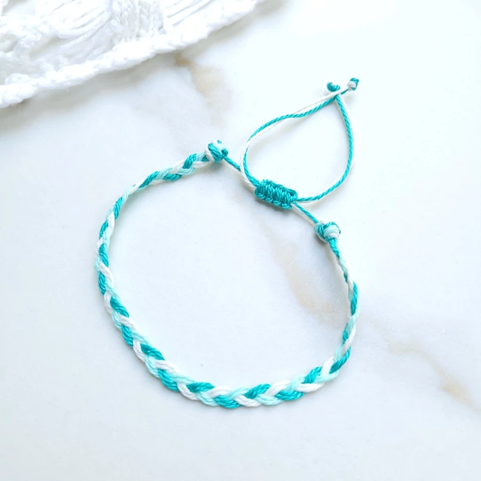Fonott zsineg karkötő -türkiz