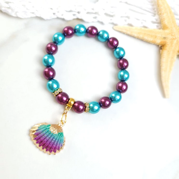 Türkiz - Lila kagyló medálos karkötő